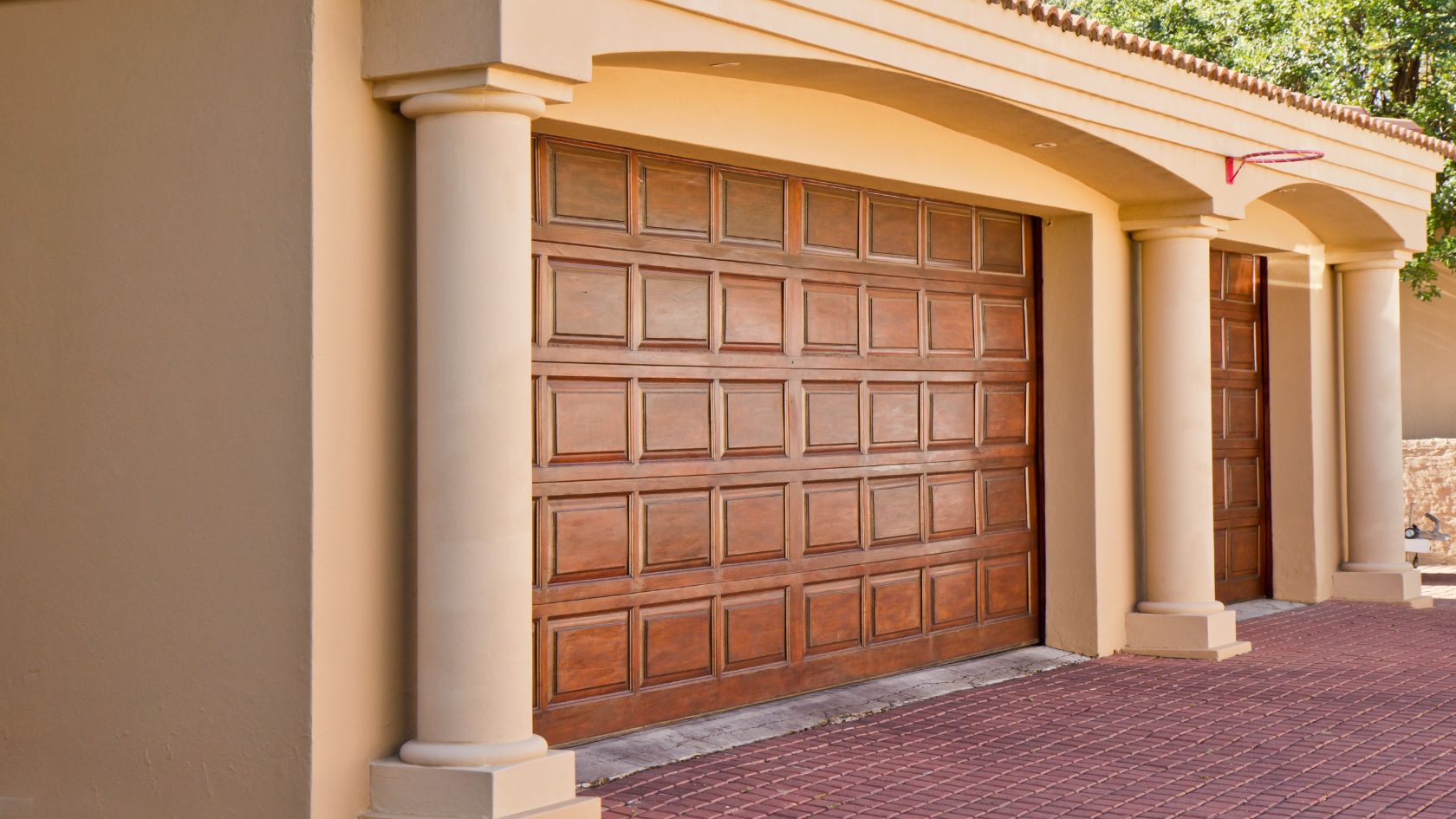 A brown garage door on the side of a building