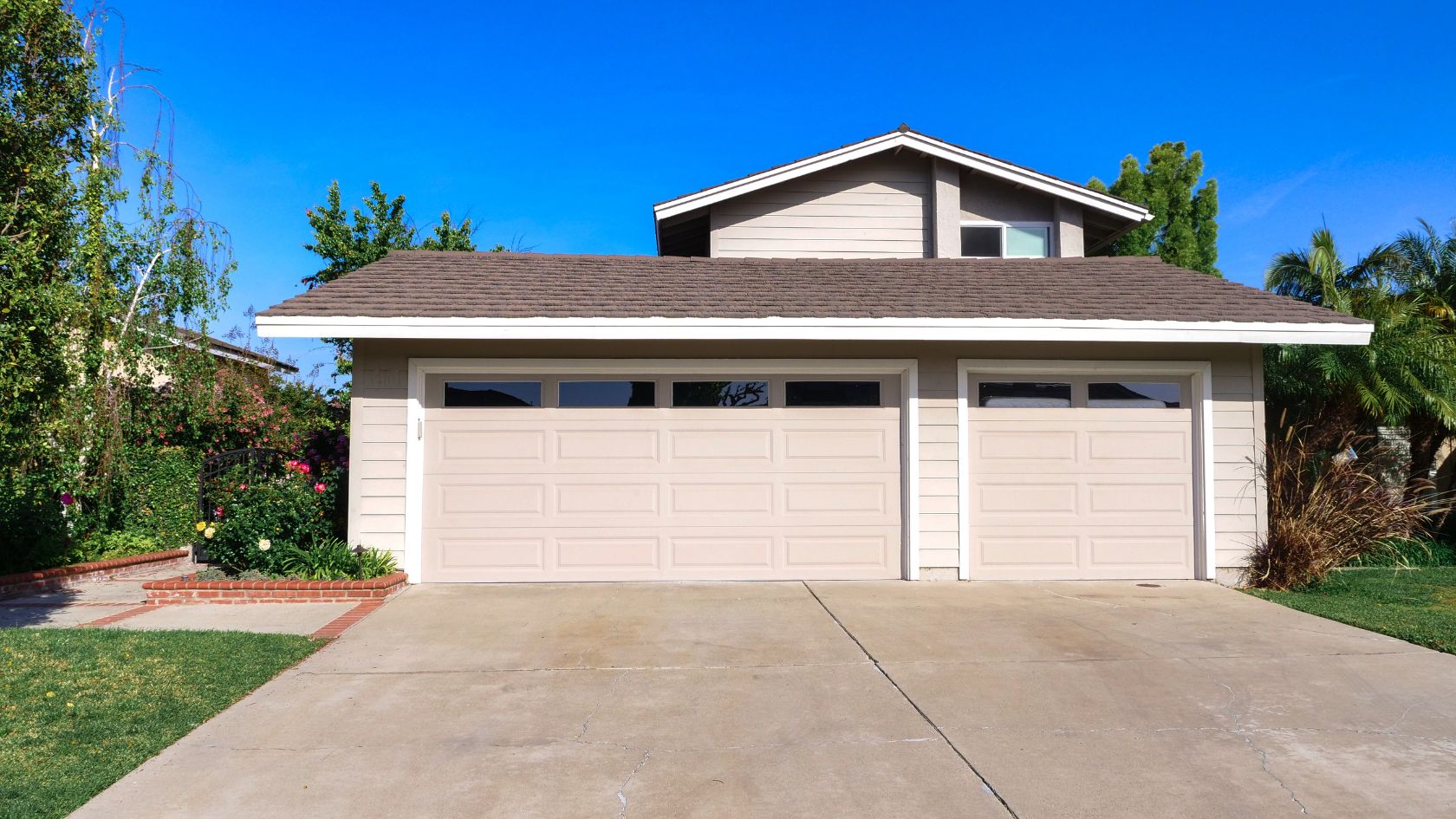 A two car garage in front of a house