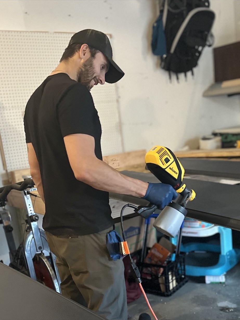 A man working on a bike in a garage